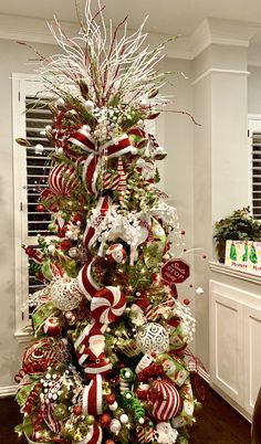 a christmas tree decorated with candy canes and ornaments