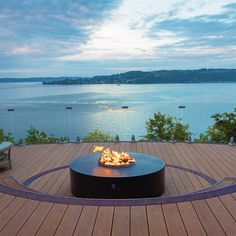 a fire pit sitting on top of a wooden deck