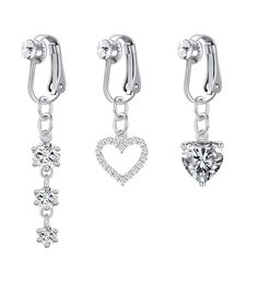 three different styles of earrings with heart and cross charms on each earring, one in white