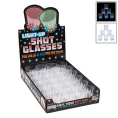 the light up shot glasses are in a display box with white plastic cups on each side