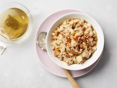 a bowl of oatmeal next to a glass of wine