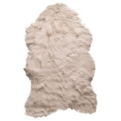 a white sheepskin rug on a white background