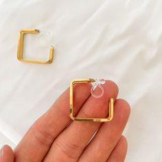 No piercing? No problem. Allergic to all metals? We got you. Introducing our newest line of clip on earrings, that will work for all types of skin types and hole-less lobes. Description: Clip-on piece has our resin, bendable piece to fit around your earlobe Metal: 18K Gold plated Stainless Steel Size: 22mm x 8mm Weight: 3g for one earring Trendy Hoop Plug Earrings As A Gift, Trendy Hoop Plug Earrings For Gift, Minimalist Nickel-free Hoop Clip-on Earrings, Minimalist Metal Plug Earrings As Gift, Small Hoop Clip-on Earrings For Gift, Hypoallergenic Metal Drop Cartilage Earrings, Minimalist Hypoallergenic Metal Cartilage Earrings, Trendy Hypoallergenic Metal Plug Earrings, Trendy Gold Tarnish-resistant Piercings