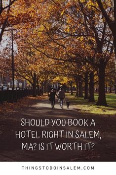 two people walking down a tree lined path with the words should you book a hotel right in salem?