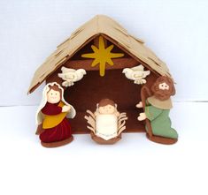 a nativity scene with figurines in the manger