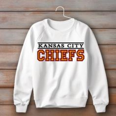 Elevate your game day attire with our Kansas City Chiefs simple Iron On Decal. A simple, yet classic box letter iron on decal, it's perfect for adding a touch of team spirit to any sweatshirt on a crisp fall night. Wear your Kansas City Chiefs Simple Iron On Decal with a sweatshirt for the big game on a nice fall night and support our Chiefs! Shirt not included. 10 inches wide.  If interested in another size, please message me first to adjust your price and order. Collegiate Sweatshirt With Letter Print For Fans, Collegiate Style Sweatshirt With Letter Print For Fans, Team Spirit Sweatshirt For Game Day With Letter Print, Team Spirit Sweatshirt With Lettering For Fan Gear, Fan Apparel Sweatshirt With Letter Print For Game Day, Baseball Season Team Spirit Sweatshirt With Letter Print, Team Spirit Sweatshirt With Letter Print For Baseball Season, College Team Spirit Sweatshirt With Text Print, Varsity Sweatshirt With Letter Print For Fans