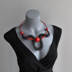 "Statement eye catching black and red necklace, Contemporary choker necklace. Attractive stylish modern collar.  Light and comfortable to wear, easy to combine with many outfit styles. Bold necklace for those who love bohemian style. Description:  - Necklace Is very comfortable and on memo wire so you can wear it as    choker, or as classic necklace when you lock her with magnetic clasp in a    position. Dimensions: - Necklace length around neck: 21\"/ 52 cm. - Earrings Length: 2\"/ 5cm. Options: - Choose accent color. - Choose product or set. Please send me a message if you have any questions or doubts. I will gladly answer to you. Search out my shop maybe you will find something for your loved ones or for you. Best regards Ivana." Trendy Red Choker For Party, Bold Handmade Necklace For Party, Handmade Bold Necklace For Party, Trendy Red Party Choker, Modern Black Necklaces For Parties, Modern Black Necklace For Party, Bold Black Jewelry For Gifts, Bold Black Jewelry For Gift, Bold Black Jewelry Gift