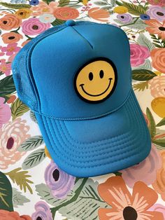 Our Smiley Face Trucker Hat is sure to bring a smile to everyone you pass by! Comfortable, breathable, and adjustable--one size fits most. Colors being restocked as quickly as possible. Keep smiling! Blue Fun Style Snapback Hat, Fun Blue Snapback Hat With Flat Brim, Blue Fun Baseball Cap One Size, Fun Blue Baseball Cap One Size Fits Most, Fun Blue Baseball Cap, Playful Blue Snapback Trucker Hat, Fun Blue Snapback Hat, Fun Blue Adjustable Snapback Hat, Playful Blue Trucker Hat, One Size Fits Most