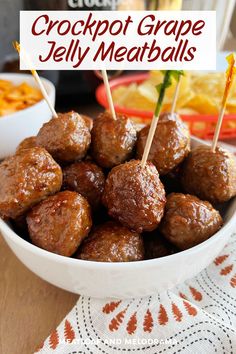 crockpot grape jelly meatballs in a white bowl with toothpicks on top