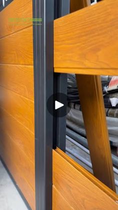 a close up of a wooden door with metal bars on the bottom and side panels