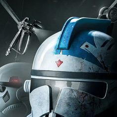 a star wars character is wearing a helmet