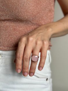 Introducing a radiant masterpiece from Moss Jewellery, behold the Square-cut Rose Quartz and Silver Ring with a captivating rose gold finish. This ring is a harmonious blend of natural elegance and contemporary chic. At its heart lies a generously sized, square-cut natural rose quartz, renowned for its soft, blush-pink tones that evoke a sense of serenity and love. The stone is expertly set in a high-quality silver base, elegantly complemented by a delicate rose gold coating, adding a touch of w Luxury Faceted Rose Gold Jewelry, Luxury Rose Gold Faceted Jewelry, Faceted Open Ring Fine Jewelry, Faceted Fine Jewelry Open Ring, Fine Jewelry Faceted Open Ring, Modern Rose Gold Gemstone Jewelry, Modern Pink Gold Jewelry For Gifts, Fine Jewelry Rose Gold Moonstone Ring, Luxury Faceted Ring Jewelry