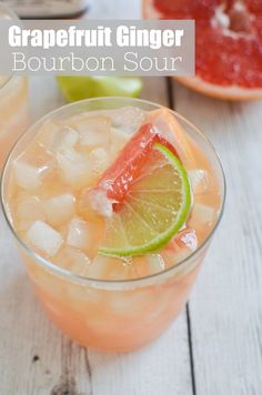 two glasses filled with ice and garnish next to sliced grapefruits