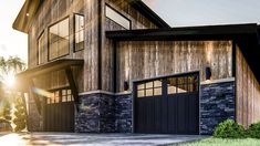 a large house with two garages on the front and one above it's doors