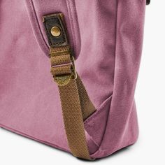 * Durable canvas and leather construction
 * Plenty of compartments
 * Adjustable-length straps Pink Canvas, Leather Accents, Cool Backpacks, Men's Backpack, Macbook Air, Vintage Looks, Leather Backpack, Front Pocket, The Go