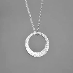 Minimalist Hammered Sterling Silver Circle Necklace. Washer Pendant. Gift For Her. This sterling silver washer pendant looks great on its own or layered with other necklaces. It has been hammered to create a modern design. It hangs on a sterling silver extendable link chain 18-20"/45-50cm  Pendant size: 2 cm (0.7") in diameter. The necklace will come in a beautiful gift box.  * CHECK OUT MORE JEWELLERY *   www.etsy.com/shop/kailajewellery Silver Circle Necklace Nickel Free, Hammered Sterling Silver Round Charm Necklace, Minimalist Silver Hammered Charm Necklaces, Minimalist Silver Circle Necklace, Minimalist Hammered Necklaces For Anniversary, Silver Round Hammered Charm Necklace, Minimalist Hammered Necklace For Anniversary, Silver Hammered Round Charm Necklaces, Silver Charm Necklace With Hammered Round Pendant