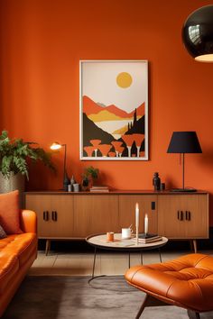 an orange living room with modern furniture and art work on the wall, along with candles