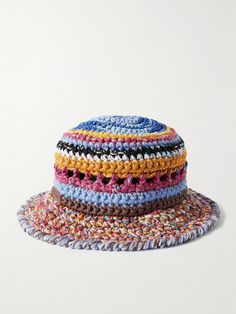 a multicolored crocheted hat is shown on a white surface, with the brimmed edge visible