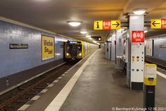 a subway train pulling into the station to pick up passengers