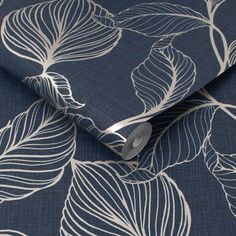 a blue and white wallpaper with leaves on it