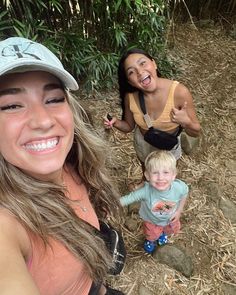 two women and a child posing for a photo