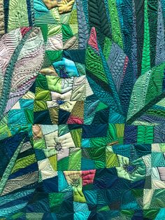 a close up view of a colorful quilt