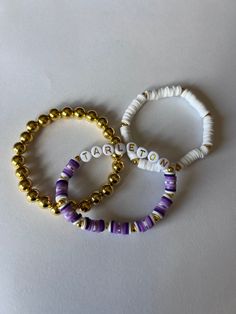 These Bracelets are a perfect way to show your school spirit on game day! They are also fully customizable and make a great gift! School Pride Bracelets, School Spirit Letter Beads Bracelets Gift, Personalized Purple Wristband For Friendship, School Spirit Beaded Bracelets With Letter Beads For Gifts, School Spirit Beaded Bracelet With Letter Beads As Gift, Personalized White Wristbands For Team Events, Personalized White Wristband For Team Events, Customizable White Wristband For Everyday, School Spirit Jewelry With Letter Beads For Gifts