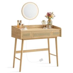 a wooden desk with a mirror and flowers on it