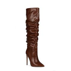 a pair of brown high heel boots with ruffles on the side