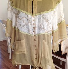 Beautiful 100%Silk Blouse. Brand New With Tag.Medium Size.Color Is A Olive Green With White Print. Spring Bohemian Silk Blouse, Bohemian Silk Short Sleeve Blouse, Bohemian Silk Blouse For Spring, Spring Bohemian Silk Tops, Bohemian Silk Top With Short Sleeves, Spring Silk Blouse, Flowy Silk Blouse For Spring, Spring Daywear Tunic Blouse, Spring Green Tunic Blouse