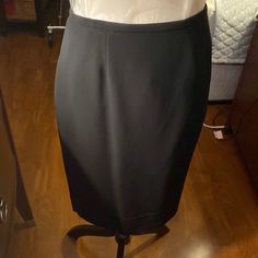 Dana Buchman Skirt. Size 8. The Skirt Was Never Worn And Is Not Hemmed. This Is A Very Expensive Skirt As You Can See The Tag Is Attached With A Price Of $168.00. There Is A Kick Pleat In The Back. Nice. Fitting Skirt. Formal Mini Skirt With Relaxed Fit And Lining, Formal Stretch Mini Skirt, Formal Lined Skort, Formal Fitted Skirted Skort, Fitted Skirted Skort For Formal Occasions, Elegant Knee-length Solid Skort, Classic Long Stretch Skirt, Formal Stretch Lined Skirt, Stretch Pleated Pencil Skirt For Formal Occasions