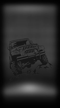 a black and white photo of a jeep on the side of a hill with rocks