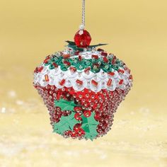 a christmas cupcake ornament hanging from a chain