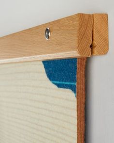 a close up of a wooden frame on a wall