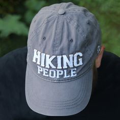 PREMIUM QUALITY: Hat, made from 100% high-quality cotton, comes packaged in a plastic polybag with a hang tag. A strap at the back of the hat allows for adjusting. IN-HOUSE DESIGN: "Hiking People" text is embroidered and sewn-in with a frayed edge, as is the We People logo on the side of the hat. The brim features screen-printed text showing the "Hiking People" logo. CARE INSTRUCTIONS: Wash by hand only with a damp cloth. Set out in the sun to dry. People Logo, Hang Tags, Adjustable Hat, One Size Fits All, Cotton Twill, Baseball Hats, Premium Quality, Hiking, Hats