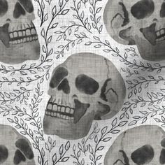 skulls with leaves and branches on a white background