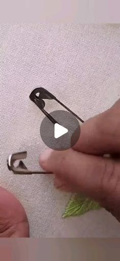 someone is using scissors to cut the fabric