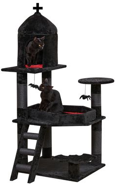 a black cat sitting on top of a scratching tower