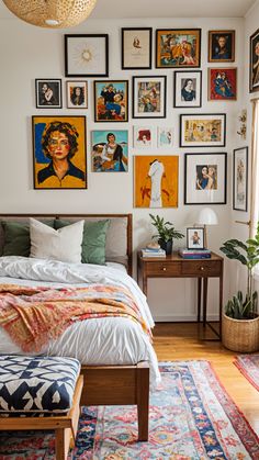 a bedroom with many pictures on the wall