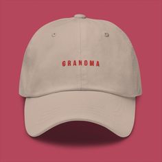 This is our Embroidered Grandma Hat. A hat that has a minimalistic Scandinavian design with an embroidered print that will show the world what you are in a subtle but classy way.  The hat has an unstructured form, a curved visor, and an adjustable buckle strap. Made out of 100% chino cotton twill, it will not only be classy but also very comfortable to wear. * 100% chino cotton twill * Unstructured, 6-panel, low-profile * 6 embroidered eyelets * 3 ⅛" (7.6 cm) crown * Adjustable strap with antiqu Beige Hat With Embroidered Logo And Short Brim, Beige Curved Brim Hat With Letter Print, Beige Embroidered Hat With Curved Brim, Grandma Hat, Be Classy, Gift For Grandma, Grandma Gifts, Adjustable Hat, Scandinavian Style