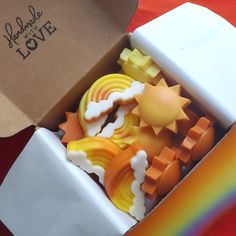 a box filled with lots of different shaped soaps