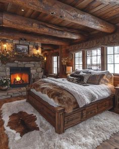 a rustic bedroom with stone fireplace and wooden bed frame, fur rugs on the floor