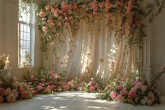 a room filled with lots of flowers next to a window