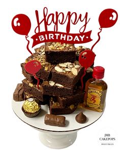 a birthday cake with nuts and chocolates on it