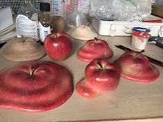 there are five apples that have been carved to look like they're ready for carving