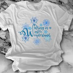 Walking in a winter wonderland...this lovely iconic holiday song, complete with watercolor painted snowflakes, makes a deliciously festive shirt. Design comes in multiple styles and colors, short sleeved, long sleeved, and as a hoodie.  Please read options carefully. Select styles are available for international shipping, please message for details. Winter Wonderland Tshirt, Winter Wonderland Shirt Ideas, Painted Snowflakes, Camp Shirt Designs, Holiday Song, Wonderland Decor, Walking In A Winter Wonderland, Skating Party, Camping Shirts