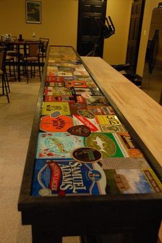 a long table covered in lots of different types of stickers