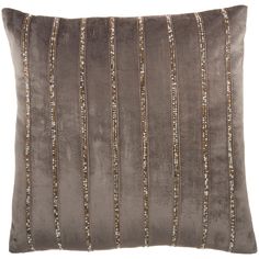 a gray pillow with silver sequins on it