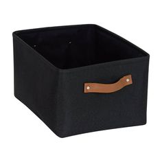 a black storage box with brown handles and leather linings on the bottom, in front of a white background