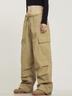 CTB relaxed-fit cotton blend cargo pants, drawstring at waistband, zip-fly, flap-close pockets at outseams. Composition - Cotton Blend Sizing: US/EU Regular Fit Model: 168cm/5'7 55kg/121lbs wearing size M Zip Off Cargo Pants, Baggy Drawstring Parachute Pants, Baggy Full-length Parachute Pants With Drawstring, Utility Wide-leg Cargo Pants With Drawstring, Hip Hop Style Khaki Cargo Pants, Cargo Style Sweatpants For Streetwear, Baggy Khaki Hip Hop Cargo Pants, Baggy Khaki Cargo Pants In Hip Hop Style, Baggy Solid Color Hip Hop Cargo Pants